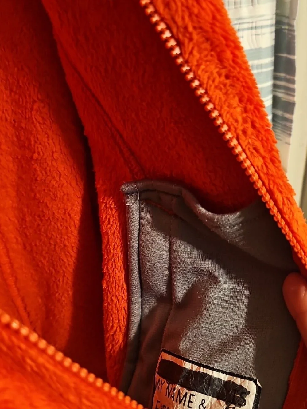 The North Face Girl's Bright Orange Plush Full-Zip Jacket with Purple Accents